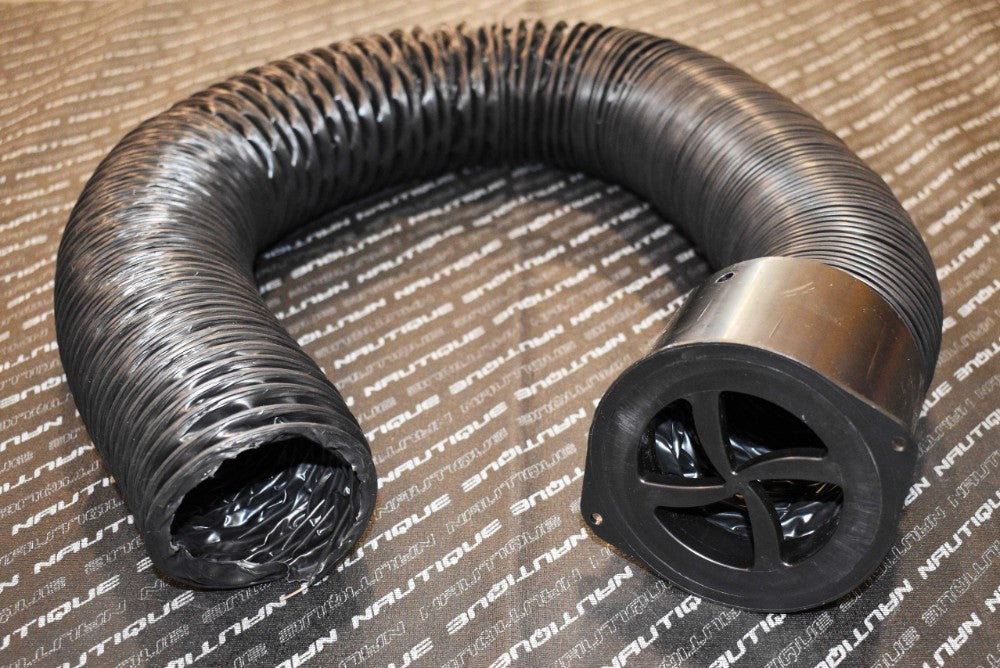 A coiled Nautique Short Closing Hot Tube (5102), a flexible black ventilation hose with a round, vented plastic end, rests on a surface featuring repeated white NAUTIQUE branding.