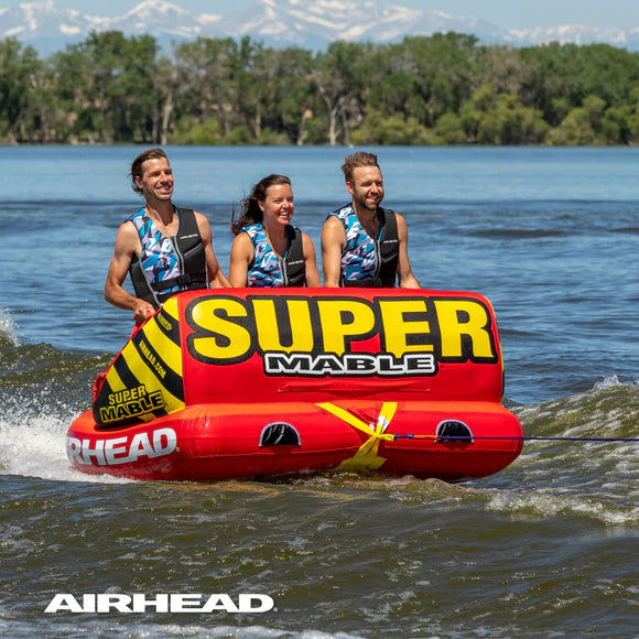 3 people ride the Airhead Super Mable 3 Person Tube chariot style