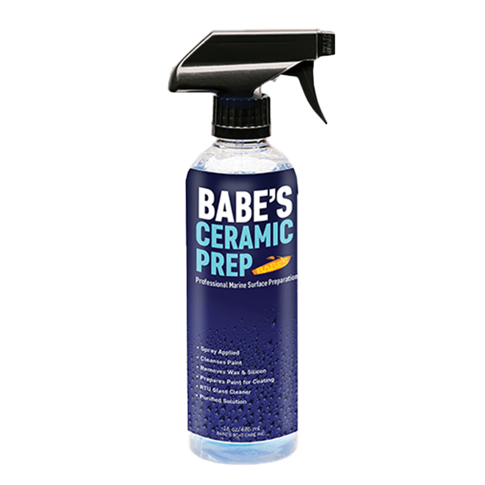 A spray bottle labeled BABE'S Ceramic Prep by BABE'S Boat Care contains blue liquid and features text on professional marine surface prep, gelcoat cleaner benefits, and application instructions on the front.