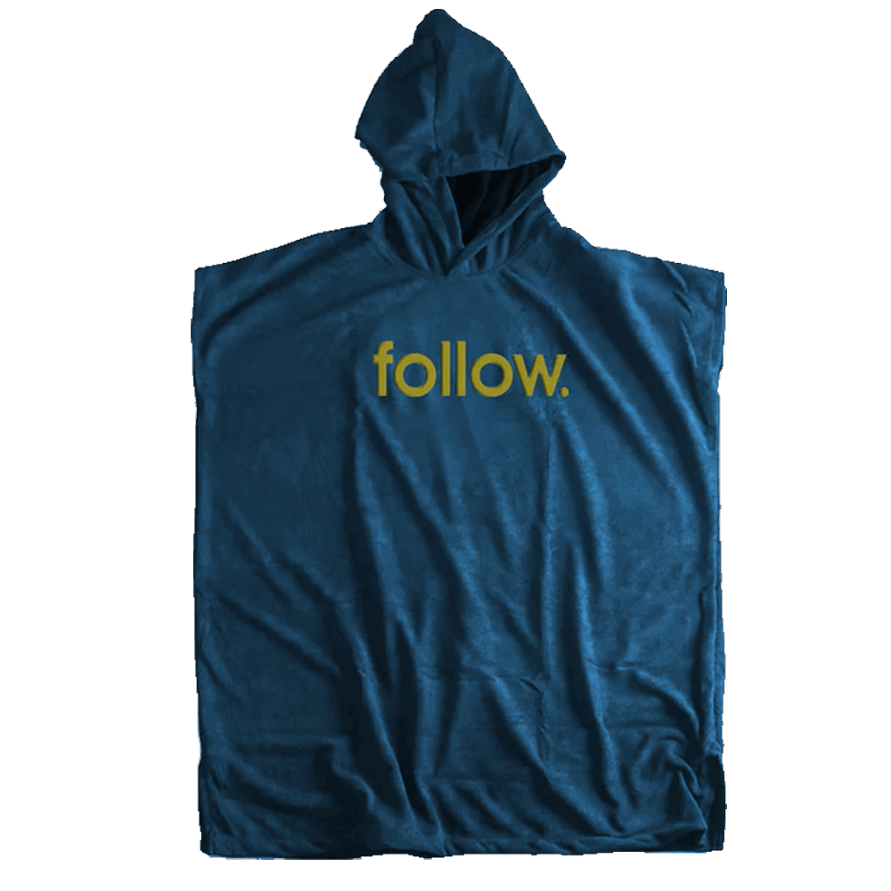 A comfy and warm Follow 3.13 Towelie - Navy poncho, perfect for the traveling rider. The stylish Follow Wake poncho style is enhanced with the word "follow" on it.