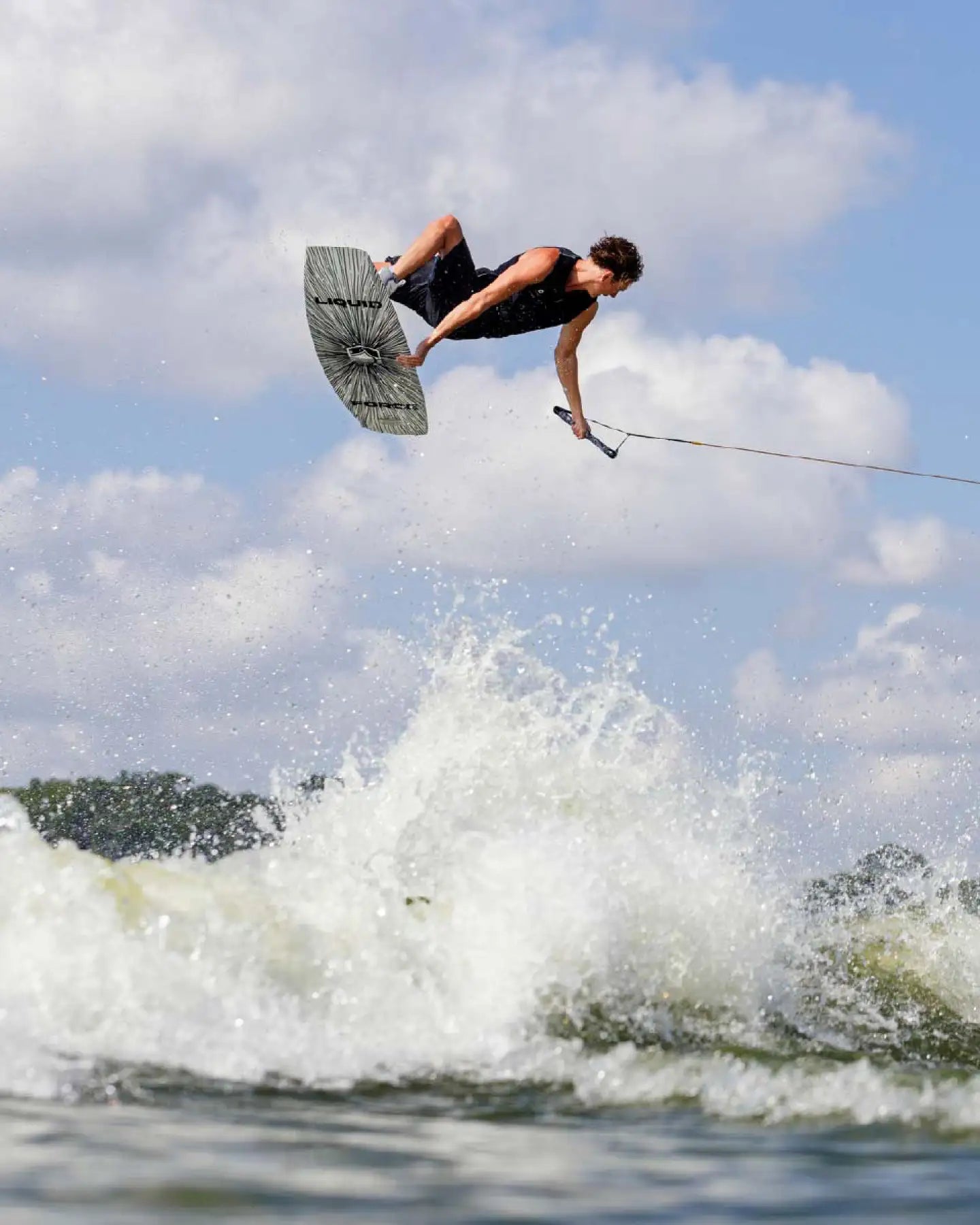 Sam Brown method grabs his wakeboard in the Follow Affiliate Men's Impact Vest - Black