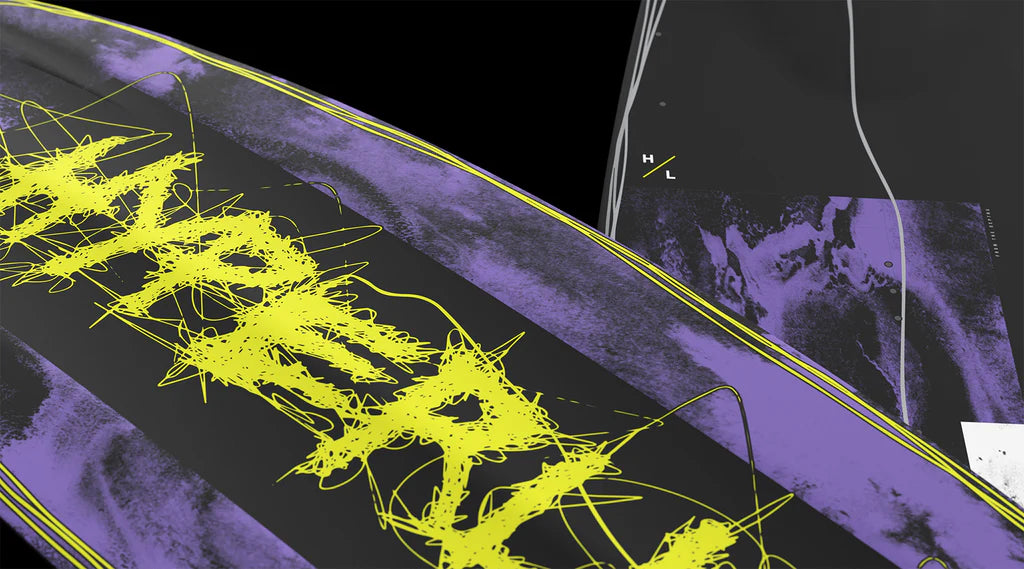 Close-up of two Hyperlite Blueprint Wakeboards with bold black and purple graphics, graffiti-style yellow text, Team OT Bindings, and “H L” letters, inspired by the 2026 Hyperlite Blueprint Wakeboard | Team OT Bindings.