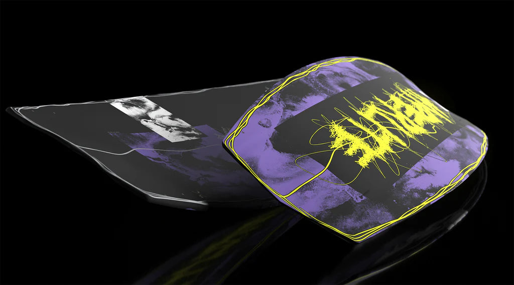 The Hyperlite Blueprint Wakeboard | Team OT Bindings 2026 features bold yellow graffiti text, purple and black strokes, and a partial black-and-white face on a glossy black deck—ideal for fans of Hyperlite's BLUEPRINT style.
