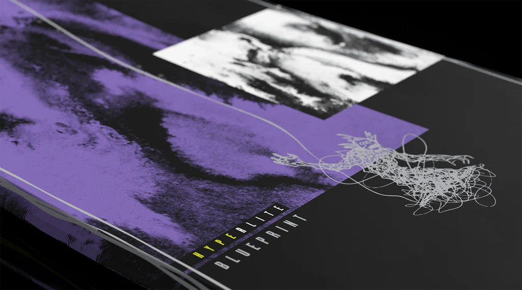 A close-up of an abstract artwork with bold purple and black brushstrokes, a black-and-white textured rectangle, and yellow and white "Hyperlite Blueprint Wakeboard | Team OT Bindings 2026" text on a dark background. Brand: Hyperlite.
