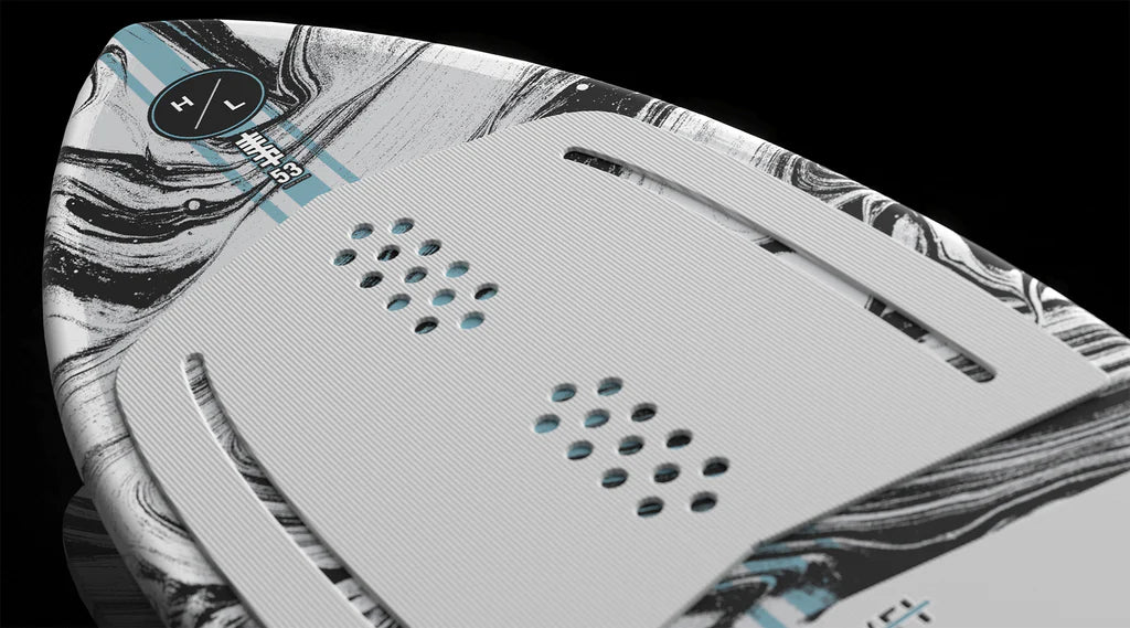 Close-up of the Hyperlite Hi-Fi Wakesurf Board 2026’s textured gray EVA traction pad with hexagonal holes and a marbled black, white, and teal nose. Number 33 and plus/minus symbols are visible near the top. Brand: Hyperlite.