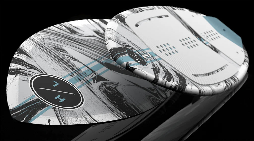 The Hyperlite Hi-Fi Wakesurf Board 2026 features a marbled black, white, and gray design with light blue stripes, a circular HL logo, and durable DuraShell construction, all from the trusted brand Hyperlite.