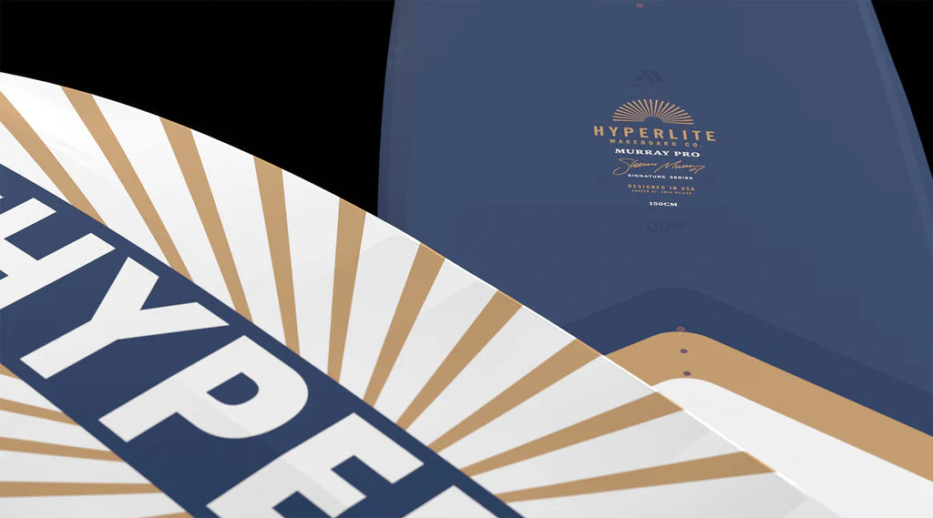 Close-up of two Hyperlite Murray Pro Wakeboards | Team OT Bindings 2026, featuring bold Hyperlite branding and blue and gold designs, with detailed product info clearly visible on the surface.