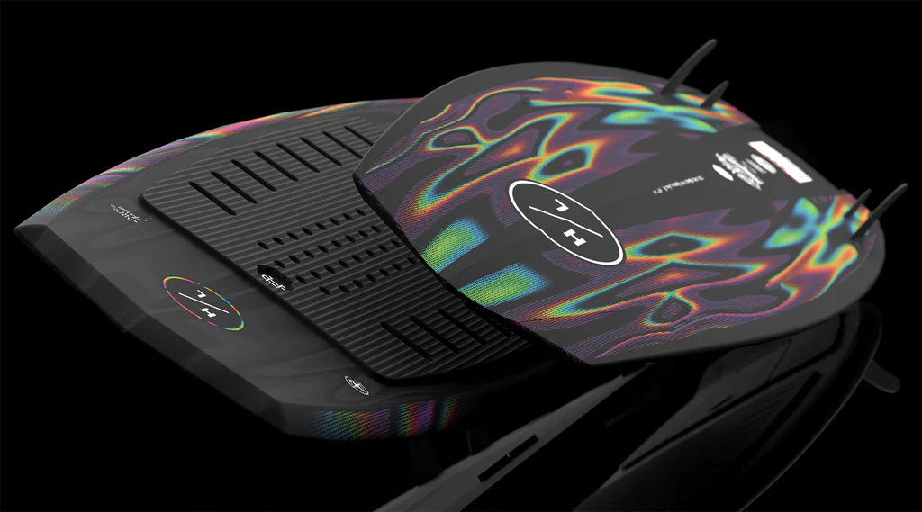 A close-up of the Hyperlite Time Machine Wakesurf Board 2026 showcases its futuristic design with an iridescent pattern and digital controls, made by Hyperlite, set against a bold black background.