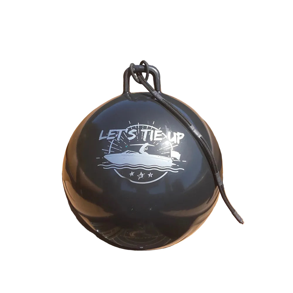 Black ball with 'Let's Tie Up' text on a boat seat with water in the background