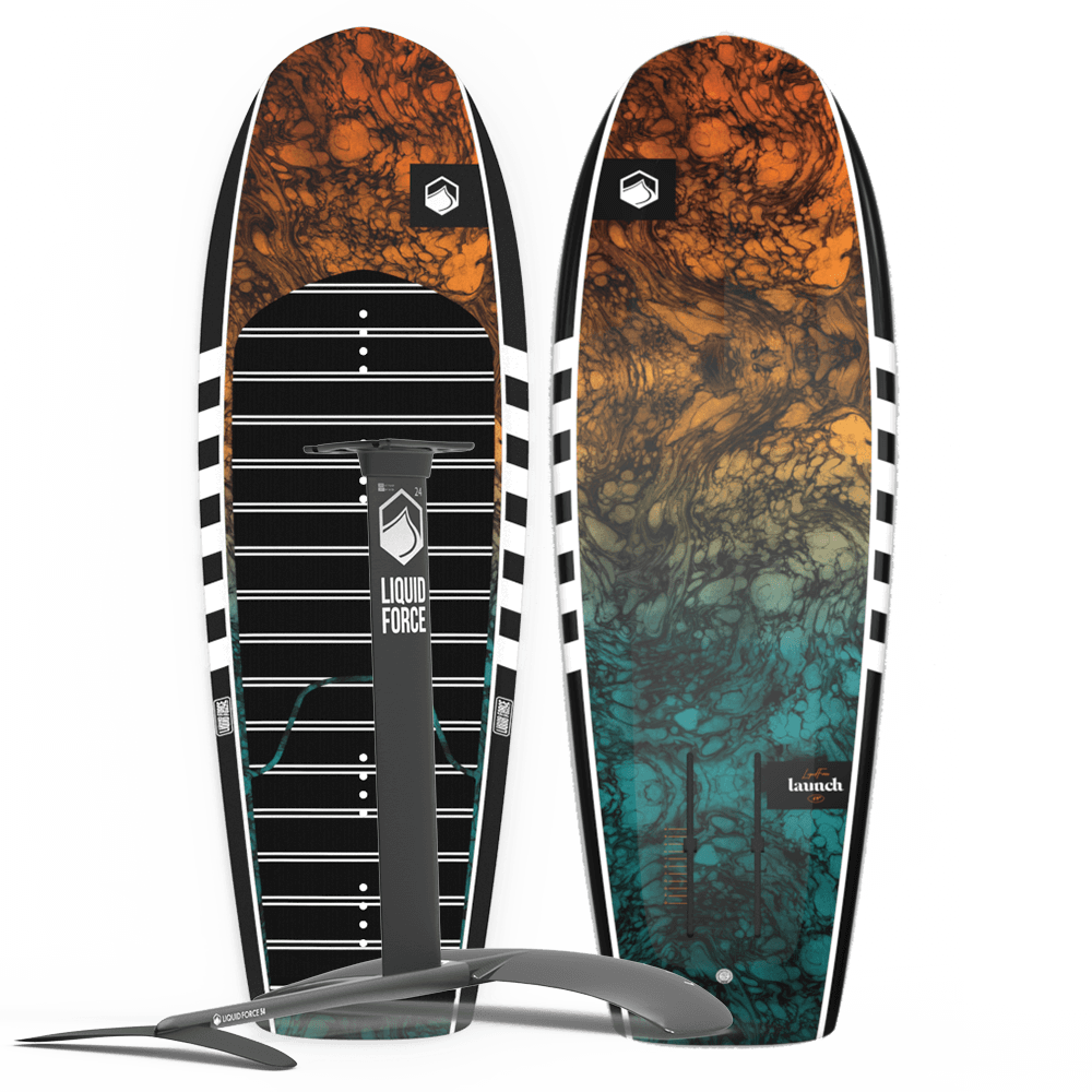 Displayed upright are two vibrant Liquid Force hydrofoil boards featuring complex designs. In front, you'll find the sleek, silver 2025 Launch | Launch 120 Foil Package by Liquid Force, ideal for exciting wake foiling adventures.