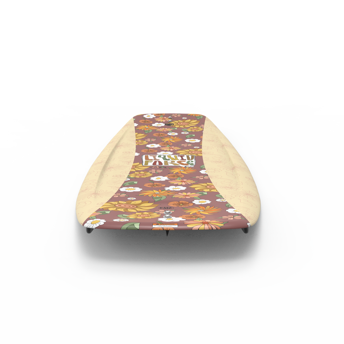 The Liquid Force 2025 ME Kid's Wakeboard paired with Dream Bindings is perfect for younger riders, showcasing a vibrant floral design featuring colorful flowers against a brown background.