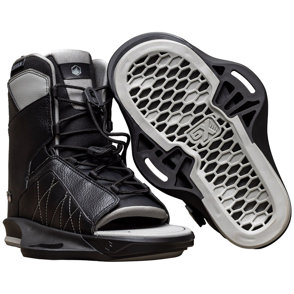 A pair of black and gray Liquid Force Remedy Wakeboard | Transit 6x Bindings 2026 boots, one upright and one showing a honeycomb-patterned sole—perfect for any all-purpose board or Liquid Force Remedy wakeboard.