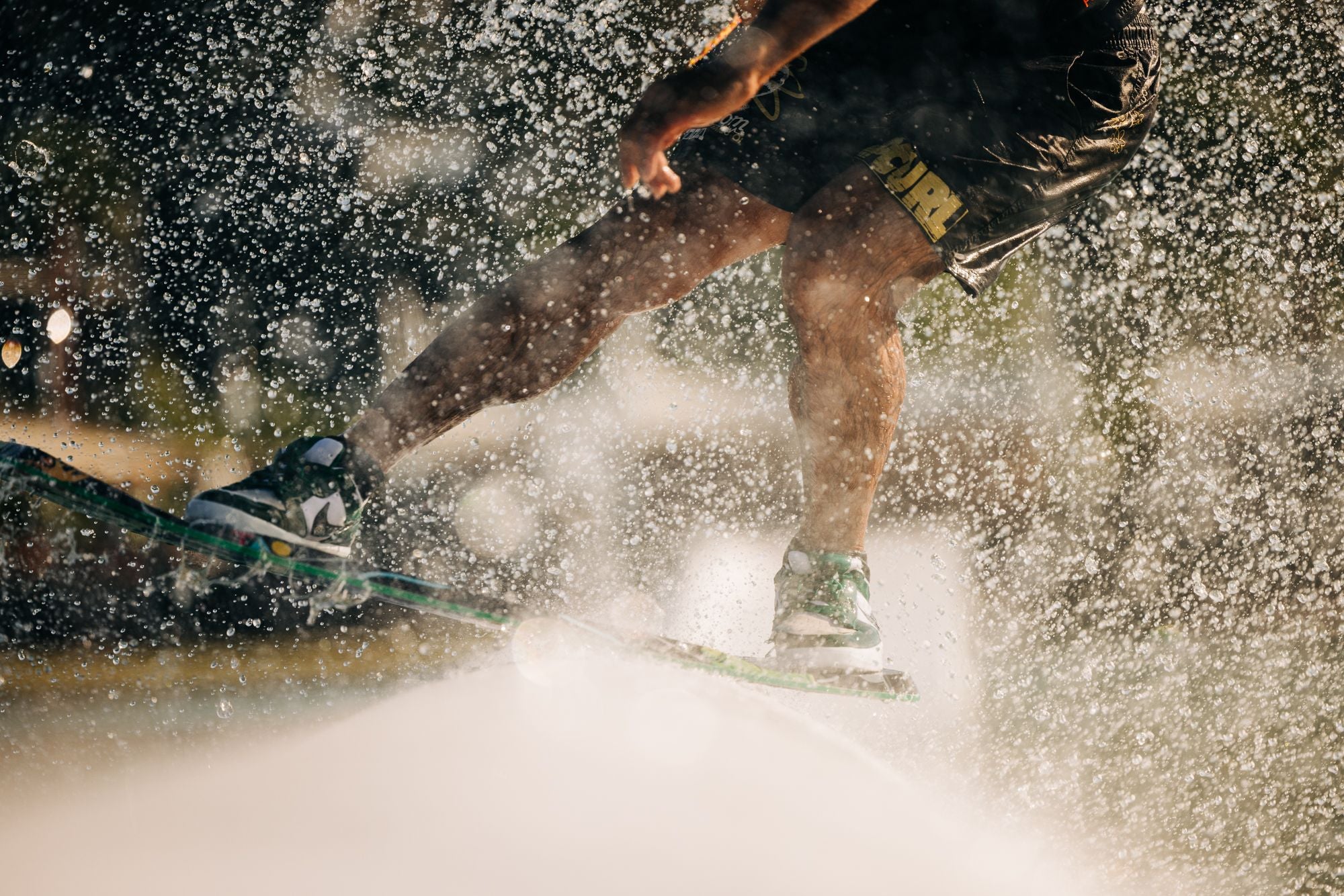 Liquid Force 2025 Tao Wakeskate - Action Shot showcasing nike sb sneakers