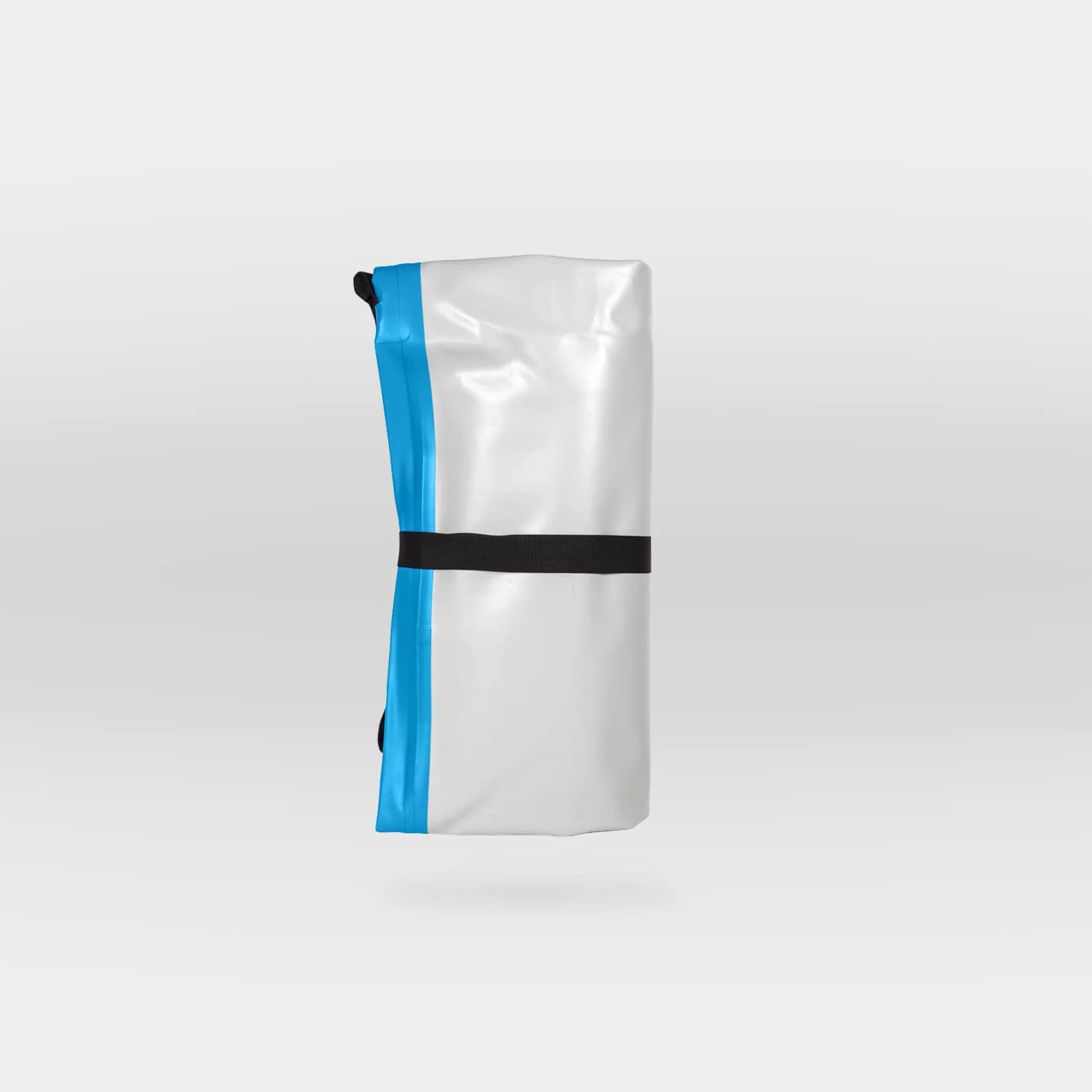 The MISSION Reef Lite 72 Inflatable Water Mat by MISSION is shown rolled up in white and blue, secured with a black strap, and set against a plain light gray background.