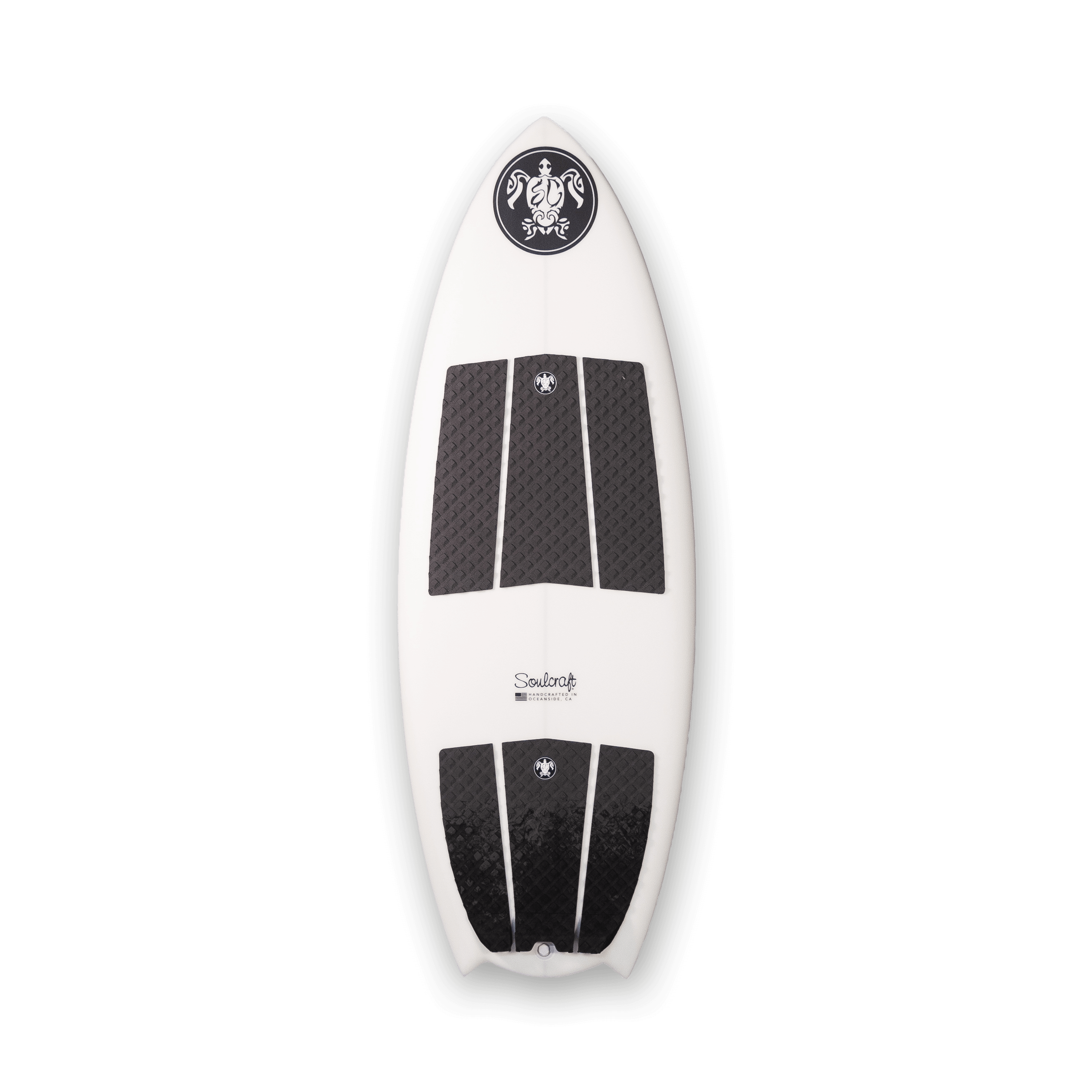 An intermediate rider's Soulcraft Control Freak Wakesurf Board designed for speed generation, featuring a striking white and black design on a sleek black background.