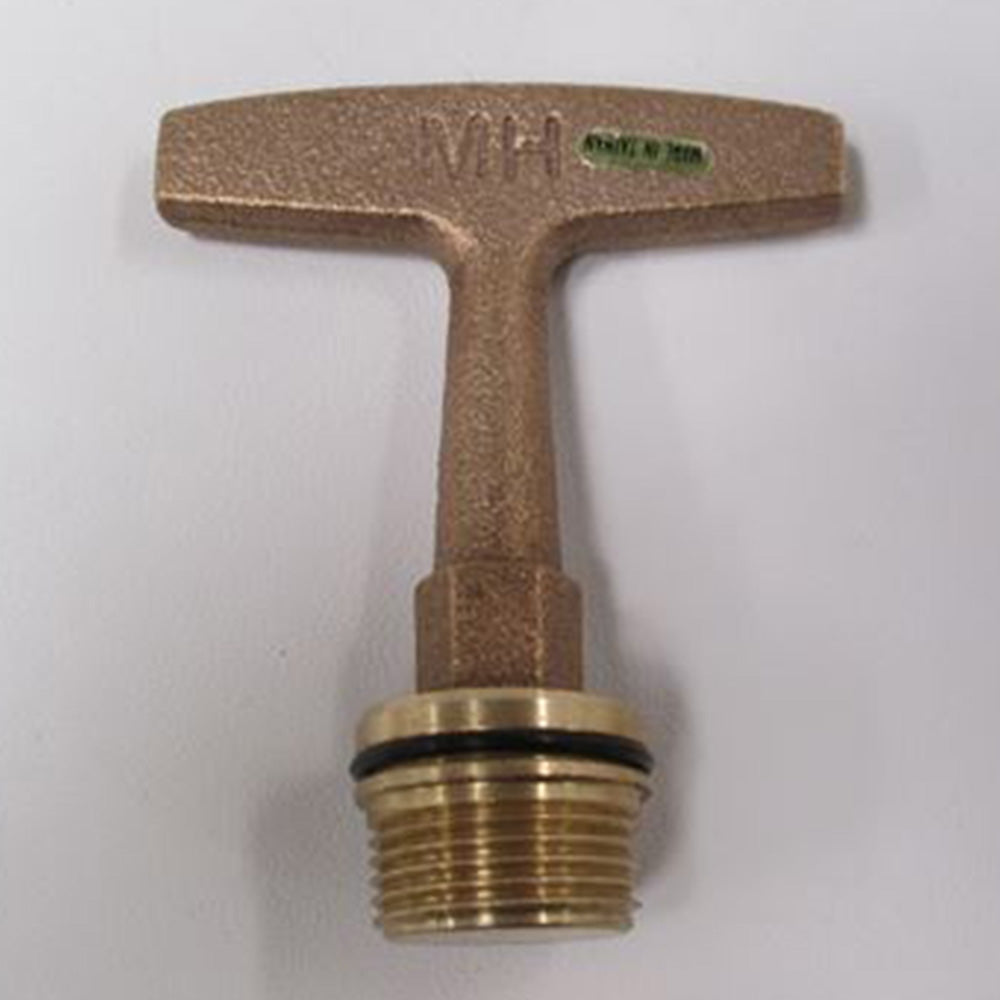 A Malibu T-Handle Drain Plug from Malibu with a threaded end rests on a white surface. The handle displays the letters VH and a green sticker.