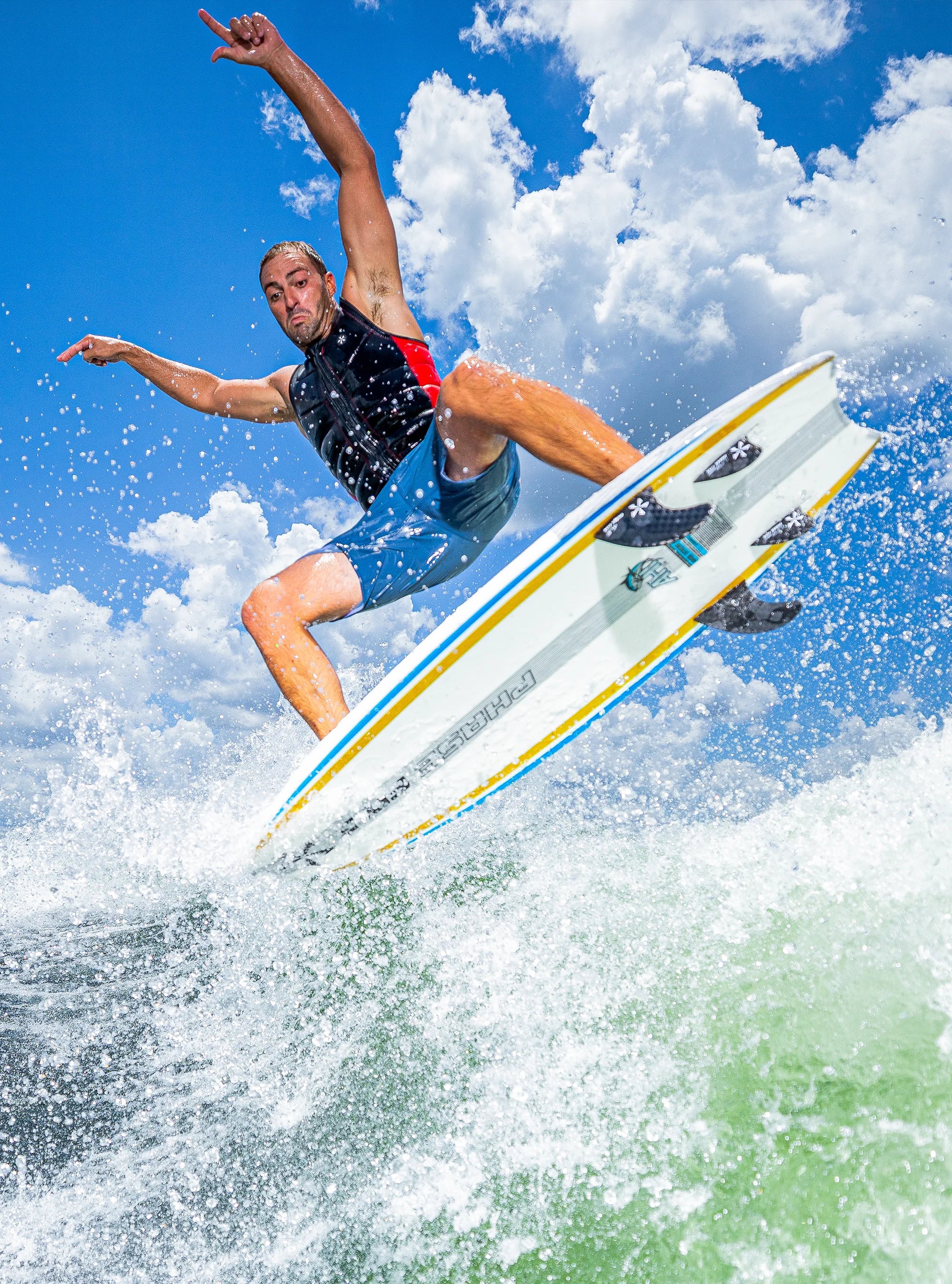 John Akerman performs an arial maneuver on his Phase 5 2025 Ahi Wakesurf Board