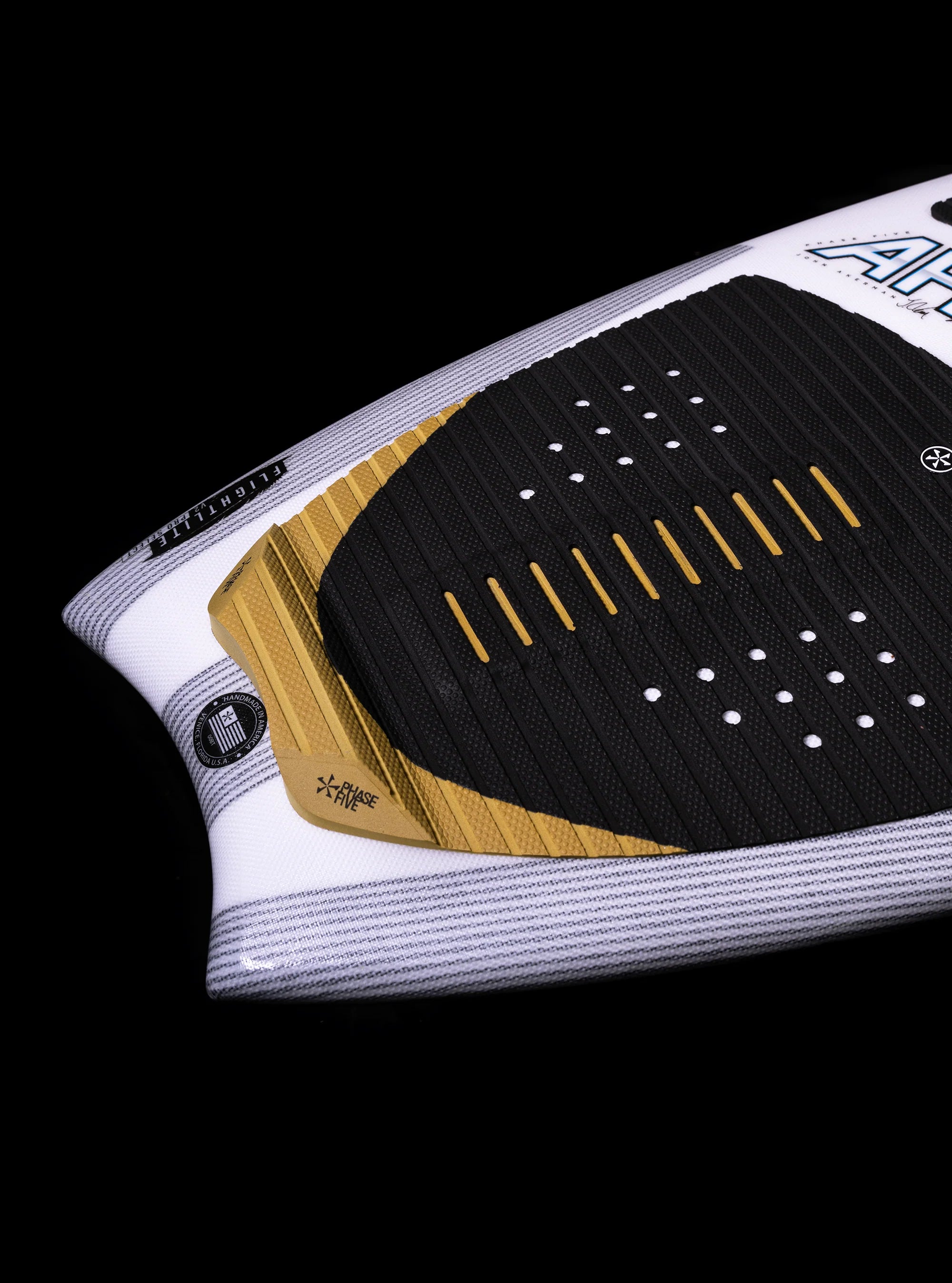 Phase 5 2025 Ahi Wakesurf Board tail featured against a black back drop