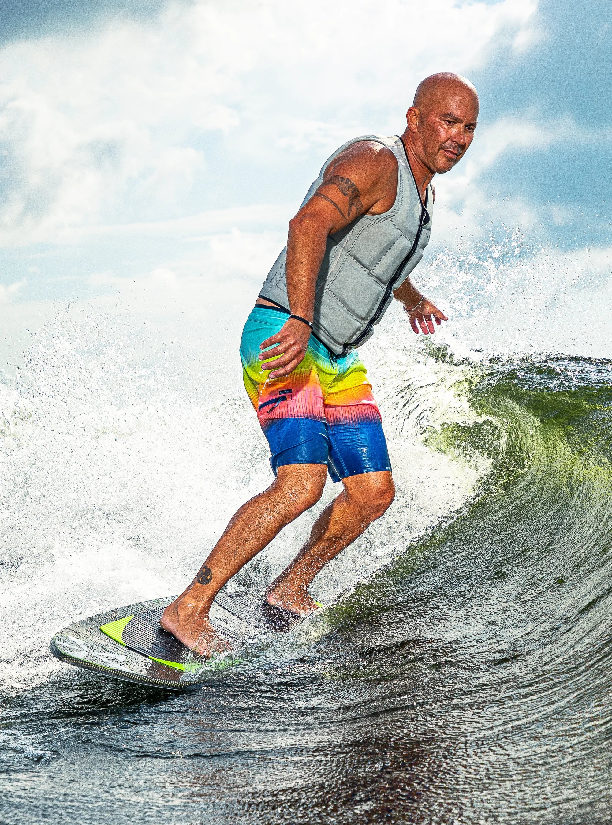 Athlete rides the wave on his Phase 5 2025 Model X Wakesurf Board