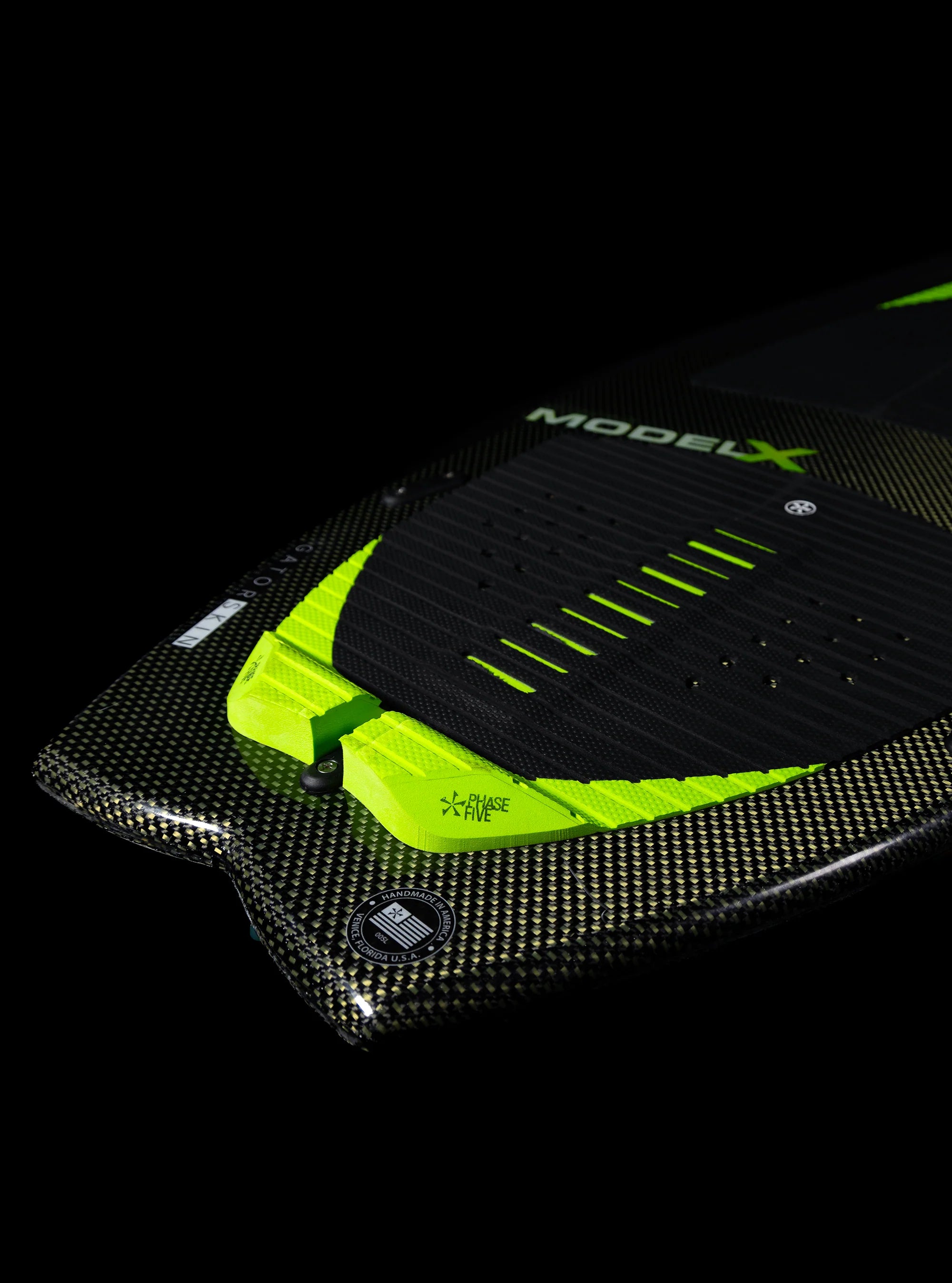 Tail of the Phase 5 2025 Model X Wakesurf Board pictured against a black backdrop