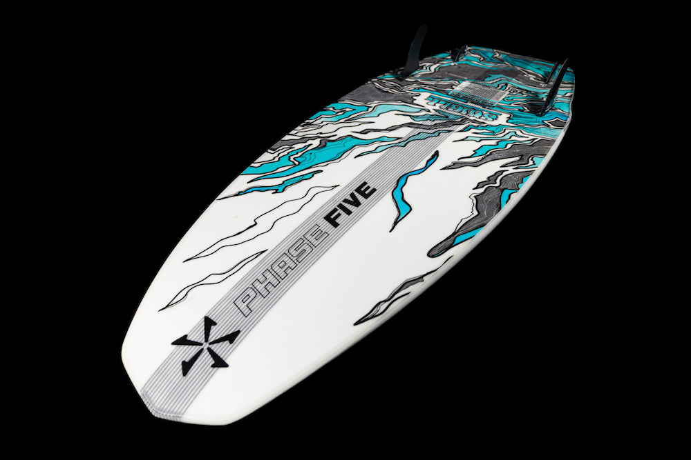 The Phase 5 Swell Wakesurf Board 2026 features black, teal, and gray abstract patterns on white, with PHASE FIVE branding and two black fins, shown against a black background.