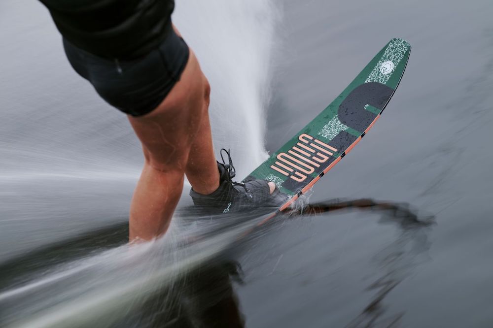 Close-up of a person wakeboarding, creating a dynamic spray on the water. The Radar Union Waterski | Prime + ARTP 2026 by Radar ensures powerful performance and easy deepwater starts for top-level fun.