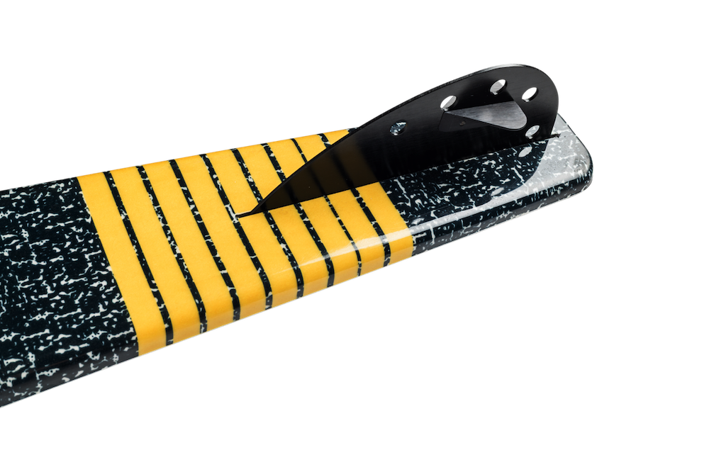 Close-up of the Radar Union Waterski | Prime + ARTP 2026 by Radar, featuring a textured black tail with a black fin and yellow horizontal stripes. Its glossy, sleek design echoes performance, captured against a plain white background.