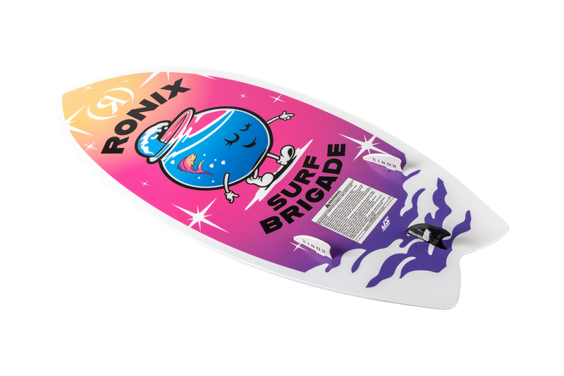 The Ronix Sonic Girl's Fish Wakesurf Board 2026 (3'9") features a bold gradient orange-to-purple design, white fins, cartoon blue character in shades and hat, wavy purple accents, RONIX SURF BRIGADE text, and a swallowtail fish-inspired shape.