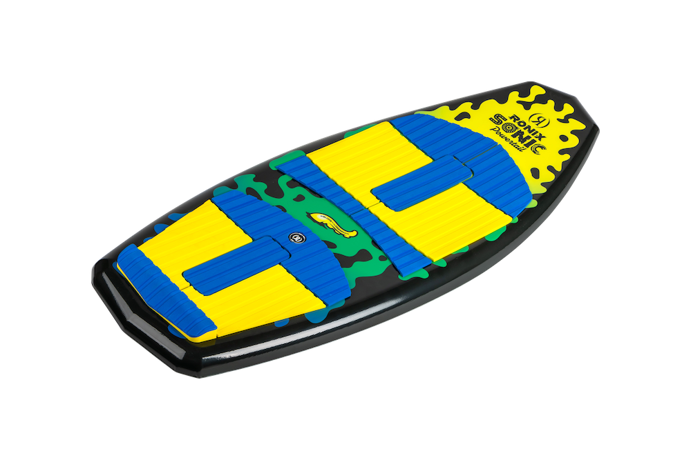The Ronix Sonic Powertail Wakesurf Board 2026 - 3'9" is a kids' board with a black base, bright yellow and blue grip pads, green camo accents, and a Sonic the Hedgehog logo near the center.