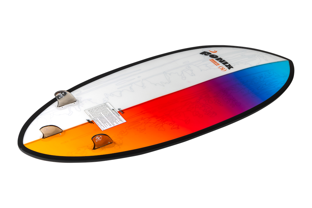 The Ronix Standard Core Skimmer 2026 features a vibrant gradient red, orange, blue, and white design, three fins, and the RONIX logo—ideal for beginner to intermediate riders seeking a skim style wakesurf board.