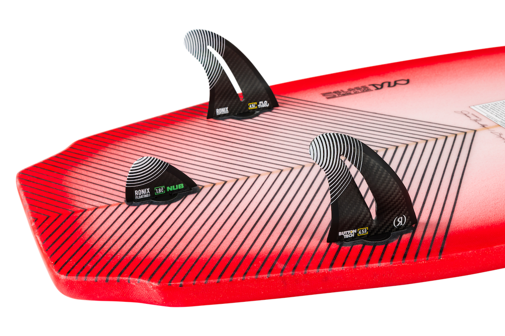 Close-up of the Ronix Flyweight Pro DNA Wakesurf Board 2026, featuring USA S-Glass construction, a geometric black and white pattern, and three black fins—ideal for competition surfers—shown against a white background.