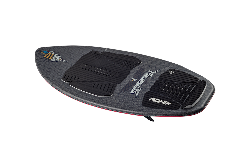 The Ronix M50 Dark Matter Wakesurf Board 2026 features black and gray textured grip pads, subtle hex patterns, and the Ronix logo near the rear. Its universal shape and sleek design are highlighted against a white background.