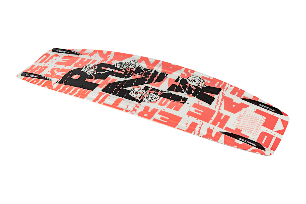 The Ronix Quarter 'Til Midnight Wakeboard | Halo Bindings 2026 is a women's board with a white base, bold red and black graphics, rose illustrations, rounded edges, glossy finish, and a hybrid rocker for versatile performance.