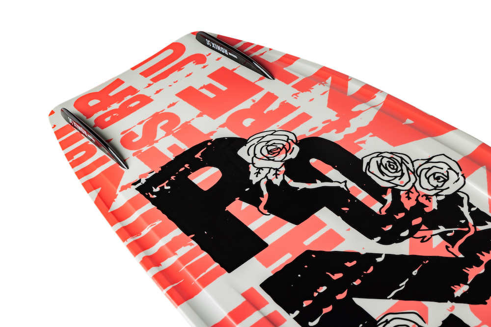 Close-up of the Ronix Quarter 'Til Midnight Wakeboard with Luxe Bindings 2026, featuring bold red and black graffiti graphics, including "PIZZA" and roses on white—perfect for stylish wake jumps.