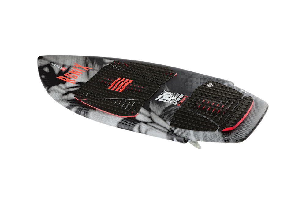 The Ronix Women's Sea Captain Wakesurf Board 2026, in black and gray with red accents, features textured grip pads, a pointed nose, and a slightly raised tail, shown on a white background.
