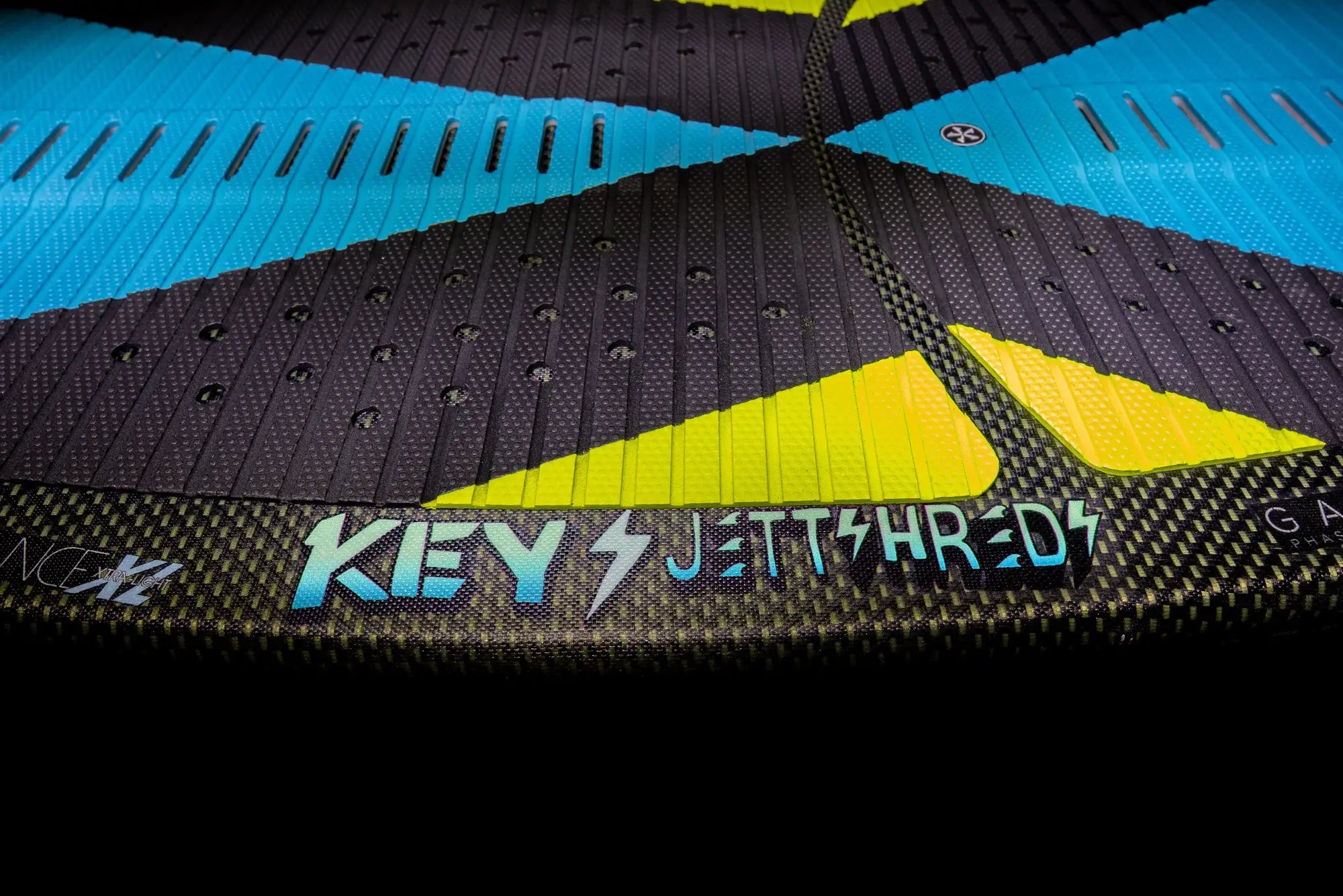 A black and blue Phase 5 2024 Key Jett Shreds Wakesurf Board with the word keythread on it, perfect for Jett who shreds keys with a single fin setup and Gatorskin.