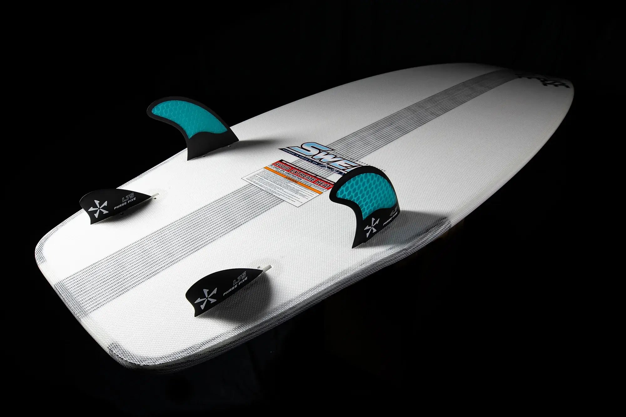 The Phase 5 2024 Swell Wakesurf Board by Phase 5 is a high performance white surfboard with blue fins on it, designed by Stacia Bank.