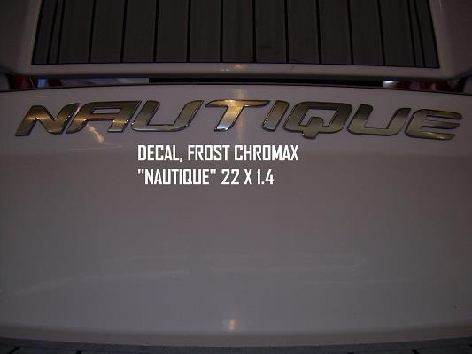 Nautique DECAL FROST CHROMAX "NAUTIQUE" 22 X 1.4 by Nautique displayed on a white surface, showcasing the sleek Frost Chromax Nautique emblem design.