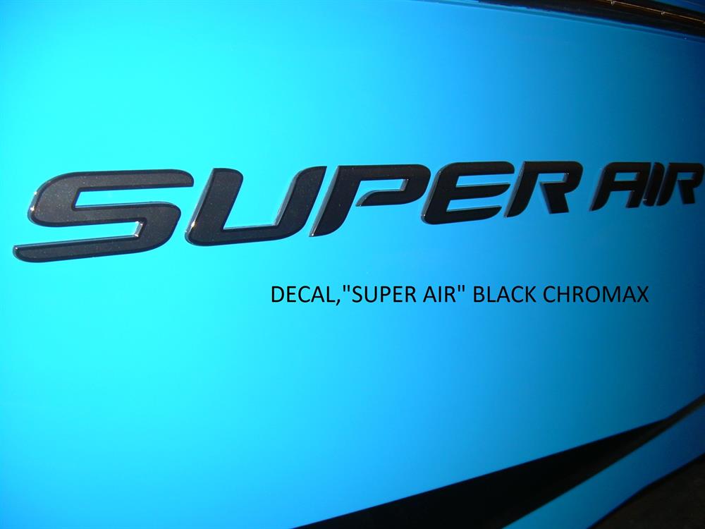 Close-up of a blue surface displaying the Nautique DECAL - SUPER AIR BLACK CHROMAX - 140057, with SUPER AIR in bold black chrome letters and the Nautique brand below.
