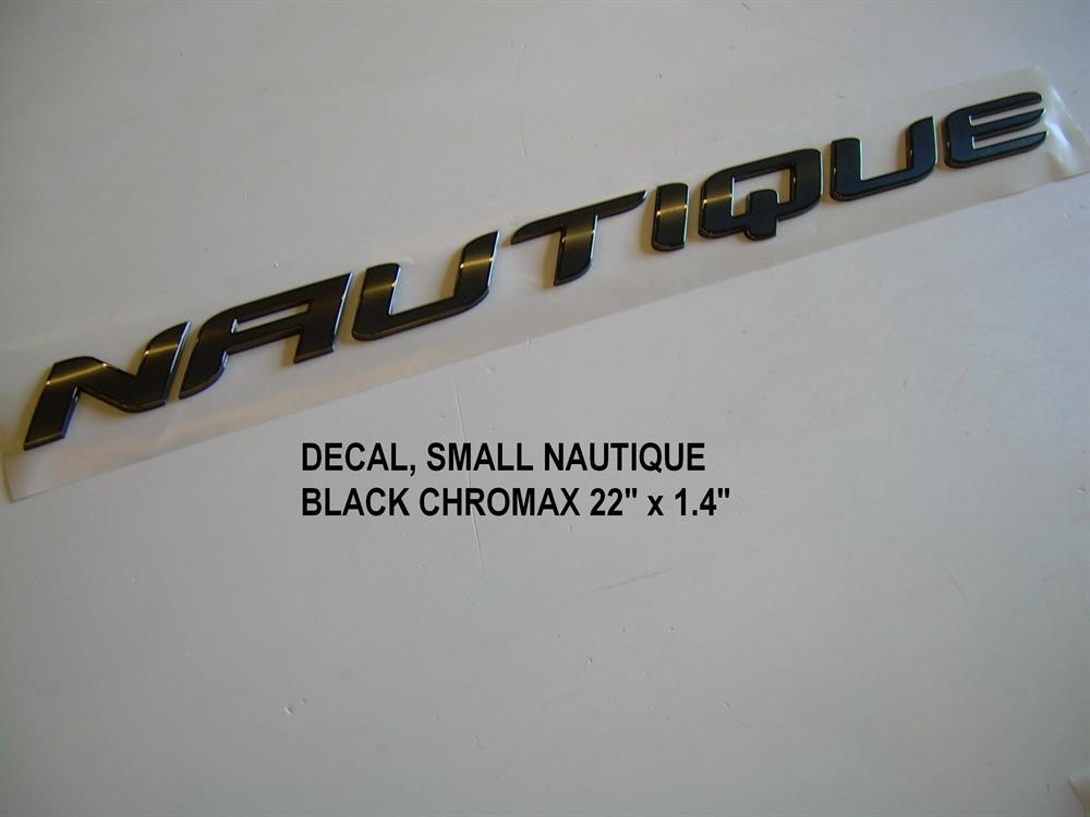 The Nautique DECAL SMALL NAUTIQUE BLACK CHROMAX 22" x 1.4" (140058) features bold angled black and gold letters, creating a sleek, modern look on a plain light background—perfect for showcasing the Nautique brand.