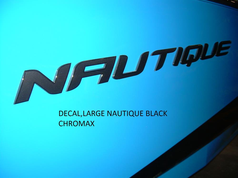 Close-up of a blue surface featuring a Nautique DECAL - LARGE NAUTIQUE BLACK CHROMAX (140089) by Nautique, with the word NAUTIQUE in bold black Chromax letters.