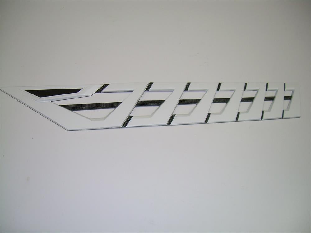 The Nautique DECAL VENT WHITE CHROMAX PORT 3.85 X 23.59 - 170096 features a white and black geometric design with sharp lines and emblem-like style, shown on a plain white background. Brand: Nautique.