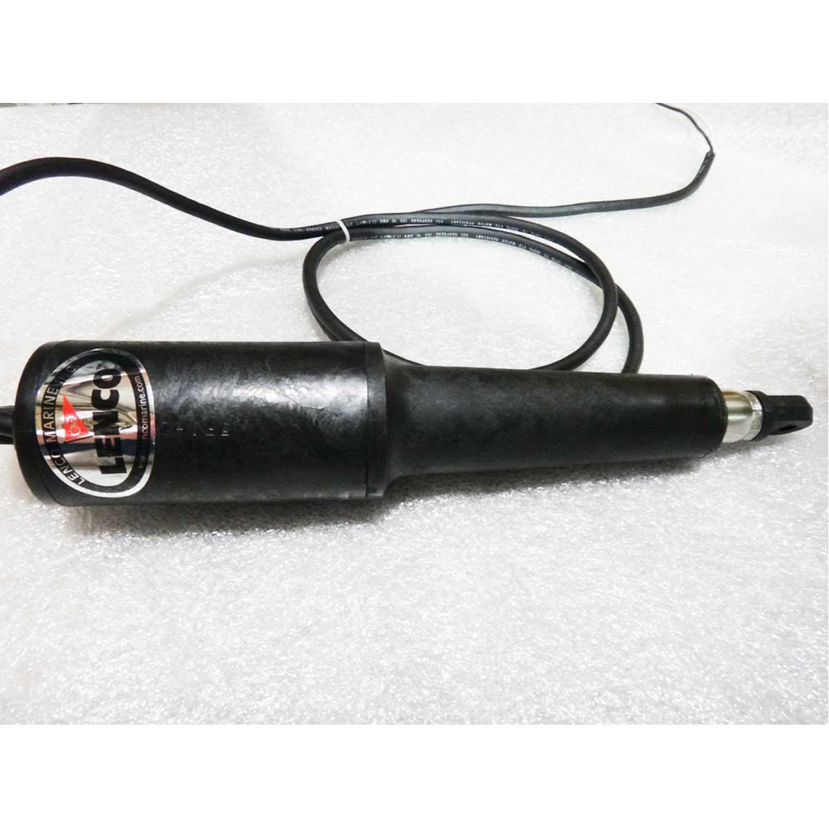 A Malibu Actuator, Surf Gate, Slow (0.65 in/sec) - 5615009, a black handheld electric tool with a cable and metal tip, lies on a textured white surface.