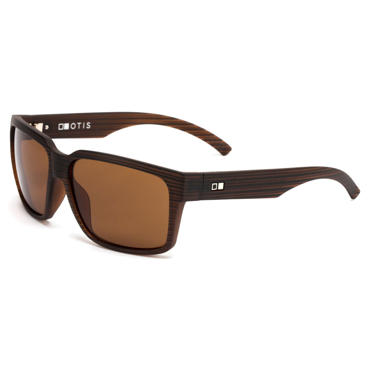 The Otis The Double - Woodland Matte/Brown Polar features rectangular mineral glass lenses with 100% UVA/UVB protection, a lightweight wood-grain textured frame, and a white OTIS logo plus small square accent on the arms.