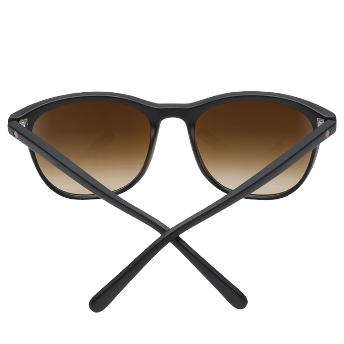 The Spy Cameo - Femme Fatale / Happy Bronze Fade sunglasses by Spy feature black frames with brown gradient polarized lenses offering UV protection, shown with crossed arms on a white background.