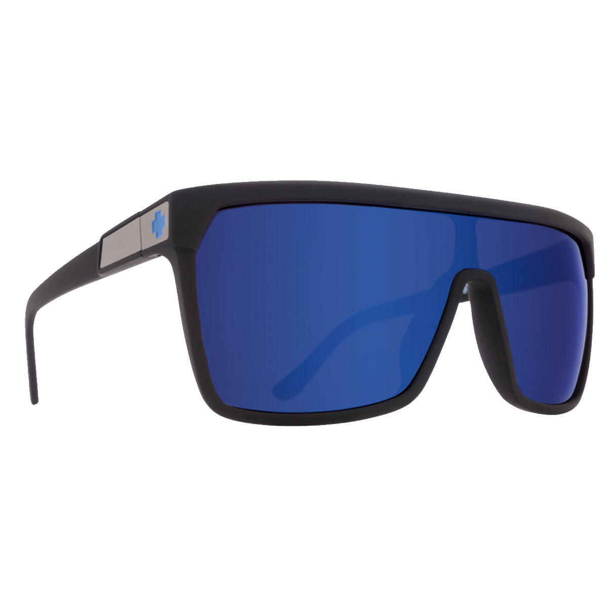 The Spy Flynn sunglasses feature a soft matte black frame, HD Plus bronze lenses with a dark blue spectra mirror finish, and a small blue cross logo on the arms near the hinges, providing superior UV protection.