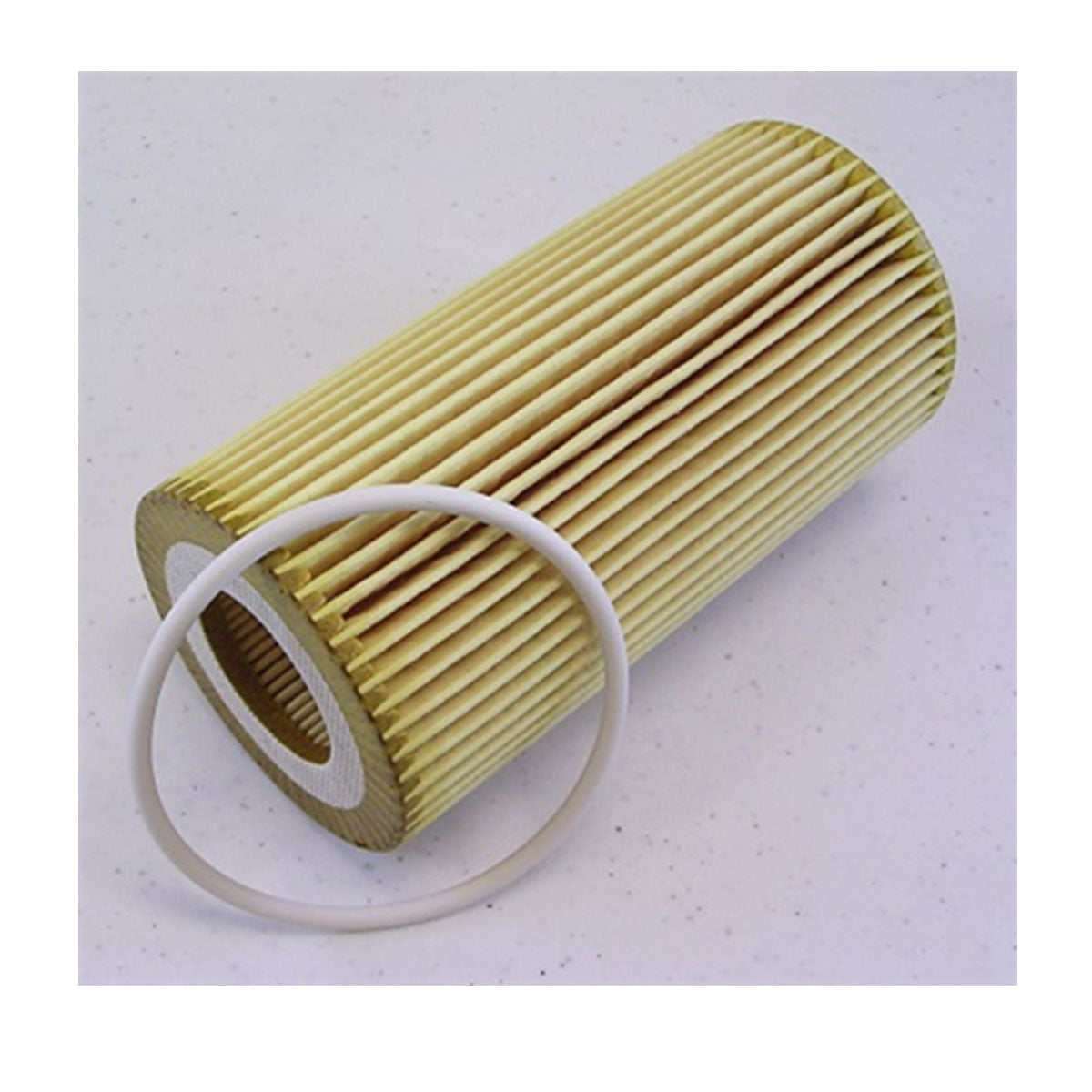 An Indmar FILTER OIL CARTRIDGE WITH ORING FORD 6.2L - 501022S, featuring a cylindrical pleated design and white O-ring, rests on a light surface. Compatible with 2016 Ford oil filter systems and ideal for Ford 6.2L engines.
