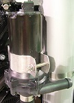 Close-up of the Indmar PUMP ASM FORD 6.2L INTERCOOLER (687002) showing its cylindrical motor housing and hose fitting—ideal for Ford 6.2L intercooler systems. Brand: Indmar.