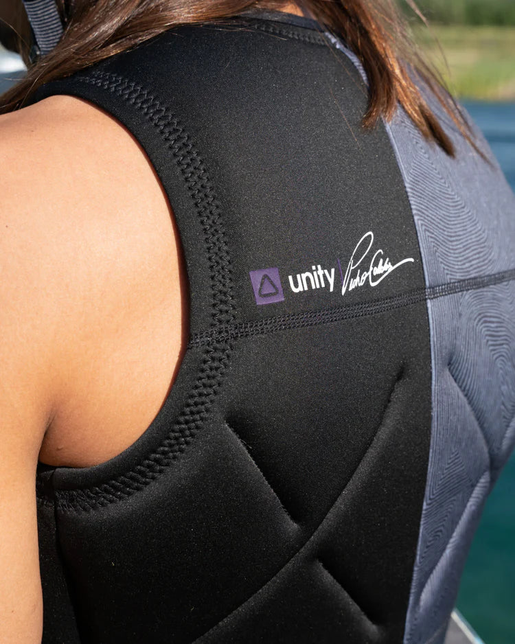 The back of a woman wearing a wetsuit, showcasing the Follow Wake 2022 Unity Men's Jacket - Black for ultimate comfort and Follow technology for enhanced performance.