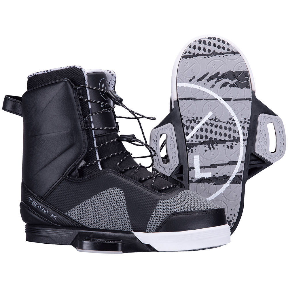A pair of black and white Hyperlite 2024 Team X wakeboard boots with Hyperlite bindings.